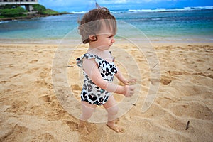 One Year Old Girl Playing In Sand