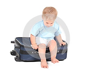 One years old baby boy with suitcase