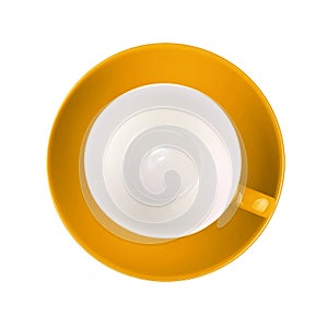 One yellow empty coffee or tea cup with saucer isolated on white background