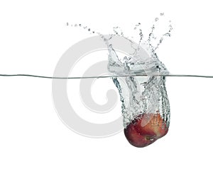 One yellow peach drop in water with splashes