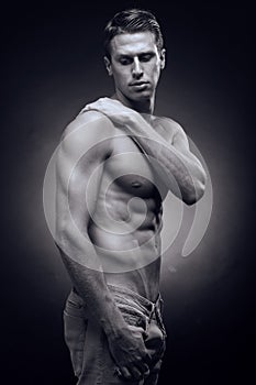 One young adult man, Caucasian, fitness model, muscular body, sh