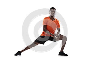 One young African-American man, athlete isolated over white background.