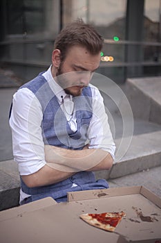 One young businessman resisting to eat his food