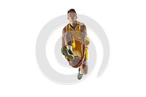 One young man, basketball player with a ball training isolated on white studio background. Advertising concept. Fit