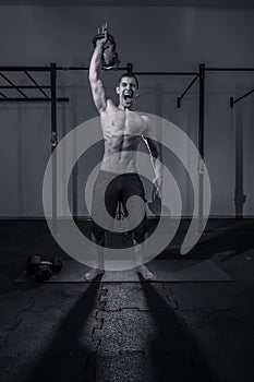 One young man bodybuilder, kettle bell