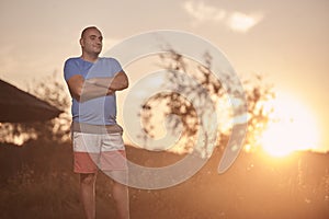 One young overweight man, 30-35 years, proud, posing standing,