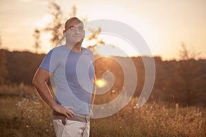 One young overweight man, 30-35 years, proud, posing standing,