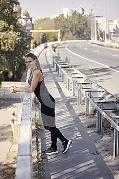 One young smiling woman, 20-29 years old, posing on bridge,