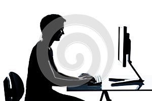 one young teenager boy or girl silhouette computer computing typing