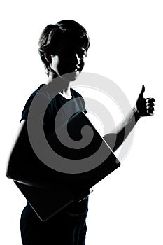 One young teenager boy girl silhouette holding carrying laptop c