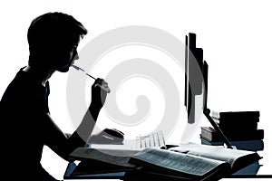 One young teenager boy girl silhouette studying with computer c