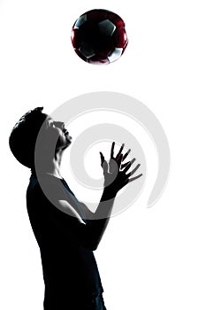 One young teenager boy girl silhouette tossing soccer football