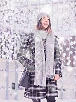 One young woman, coat scarf hat winter laughing