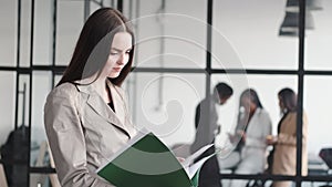 onfident businesswoman In suit working at office