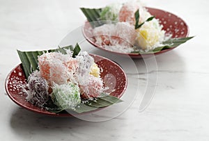 Ongol Ongol Singkong, Indonesian Traditional Steamed Cake Made From Cassava with Garted Coconut Coating. One Various of Jajanan photo