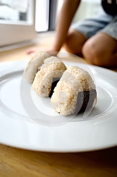 Onigiri, also known as omusubi, nigirimeshi, or rice ball, i