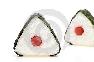 Onigiri. Rice triangle with nori and umeboshi