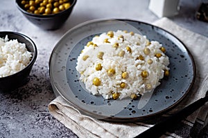 Onion green peas rice in a plate