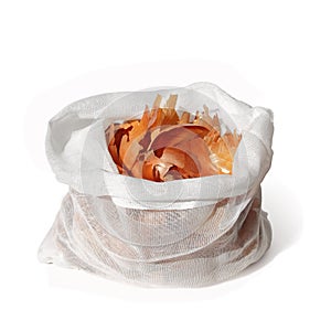Onion peel in bag on white
