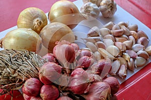 Onion, red onion and garlic on the table