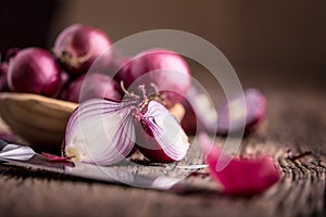 Onion. Red onions on very old oak wood board