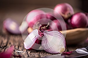 Onion. Red onions on very old oak wood board