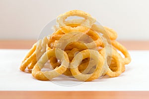 Onion ring on a waxed white paper