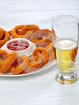 Onion rings and glass of beer