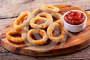 Onion rings with ketchup photo