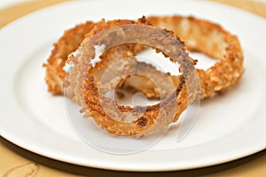 Onion rings on white plate