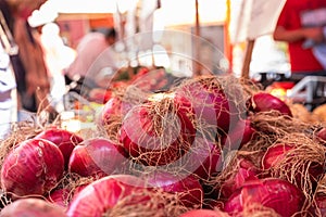 Onion on a street food market Ballaro in Palermo Sicily, vegetable stand with blurred background