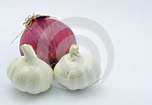 Onion and two garlic close up