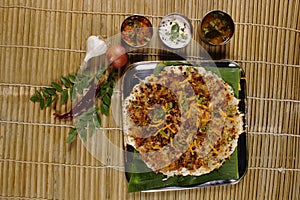 Onion uthappam with sambar and coconut chutney.