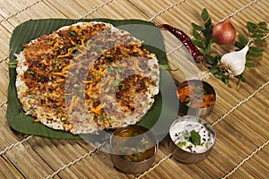 Onion uthappam with sambar and coconut chutney.