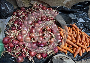 Onions and carrots for sale in the Medina Souk in Meknes, Morocco.