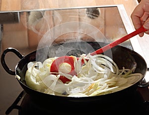 Onions cooking in a frying pan