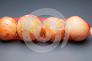 Onions in a mesh bag