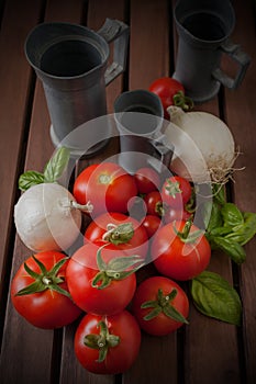 Onions and Tomatoes on wood table