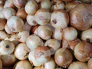 Onions vegetable are stacked on the basket for sale in the market