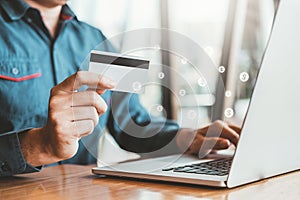 Online banking businessman using Laptop with credit card Shopping online Fintech and Blockchain concept photo