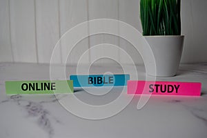 Online Bible Study write on a sticky note isolated on Office Desk