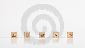 Online business communications concept of wooden cubes on white