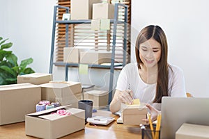 Online business concept, Asian business women checking product and preparing for delivery to client