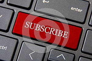 Online business concept - Laptop keyboard with red Subscribe button. Subscribe online