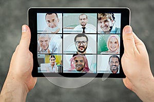 Online business conference screen in hands