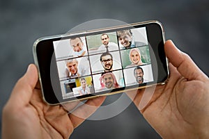 Online business conference smartphone in hands