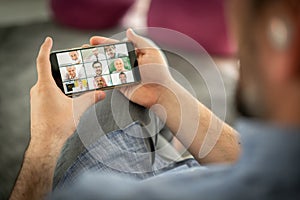 Online business conference smartphone in hands