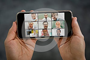 Online business conference smartphone in hands