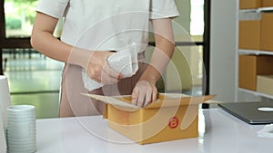 Online Business Owner Preparing Orders. Packaging in Ceramics Business, Slow Motion shot