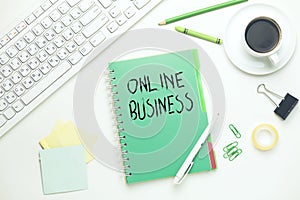 Online business text on notepad with keyboard